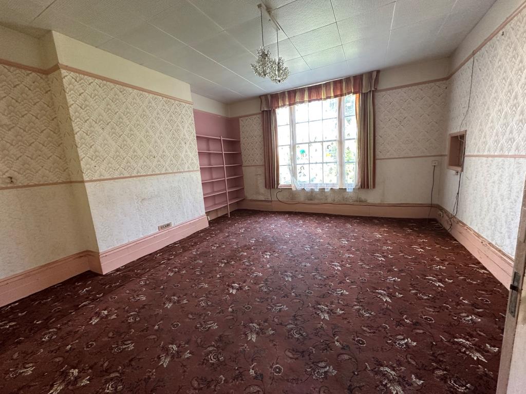 Lot: 129 - EIGHT-BEDROOM SEMI-DETACHED HOUSE FOR REFURBISHMENT - Dining Room with window overlooking garden